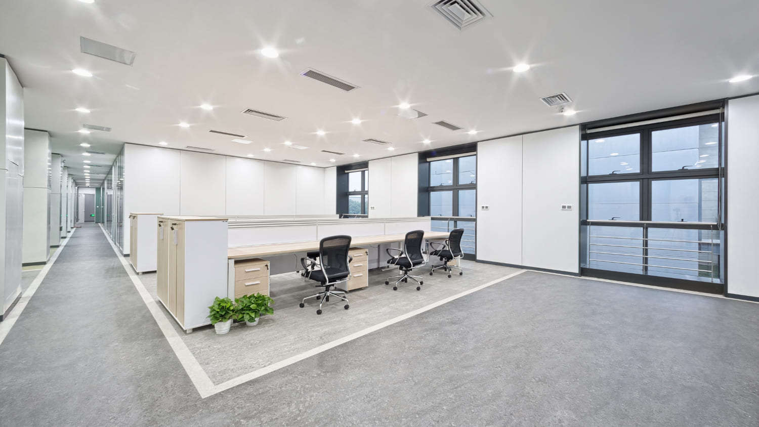 A very modern office space with concrete floors